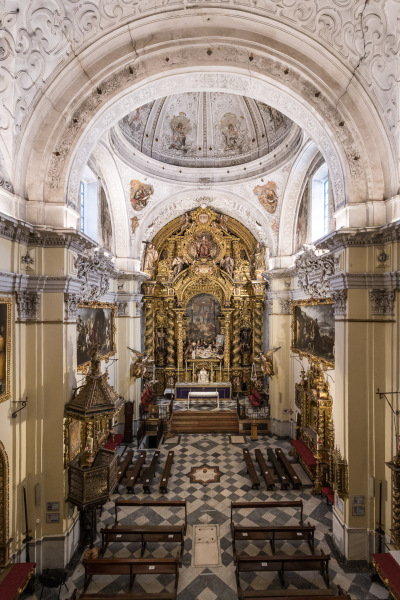 The Baroque-style church of Hospital de la Santa Caridad (Capilla de San Jorge) in Seville (Spain) completed in 1670., view from the chorusThe interior decoration of the church was programmed by Miguel Mañara and artists such as Murillo, Valdés Leal, Pedro Roldán and Bernardo Simón de Pineda took part in it. The high altarpiece of the Charity shows the relief of Christ’s descent (Valdés Leal) and the sculpture group (Pedro Roldán), while the altarpiece was made by Bernardo Simón de Pineda