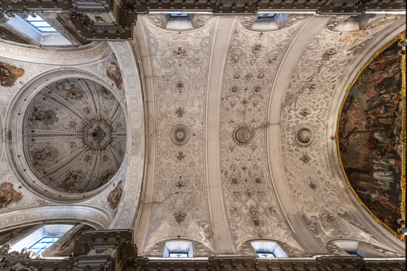 The Baroque-style church of Hospital de la Santa Caridad (Capilla de San Jorge) was promoted by Miguel de Mañara in Seville, Spain and completed in 1670.The church is a single nave with a barrel vault decorated with plasterwork with abstract shapes and a slightly oval dome. The entire upper part of the church is covered with tempera paintings made by Valdés Leal between 1678 and 1682.